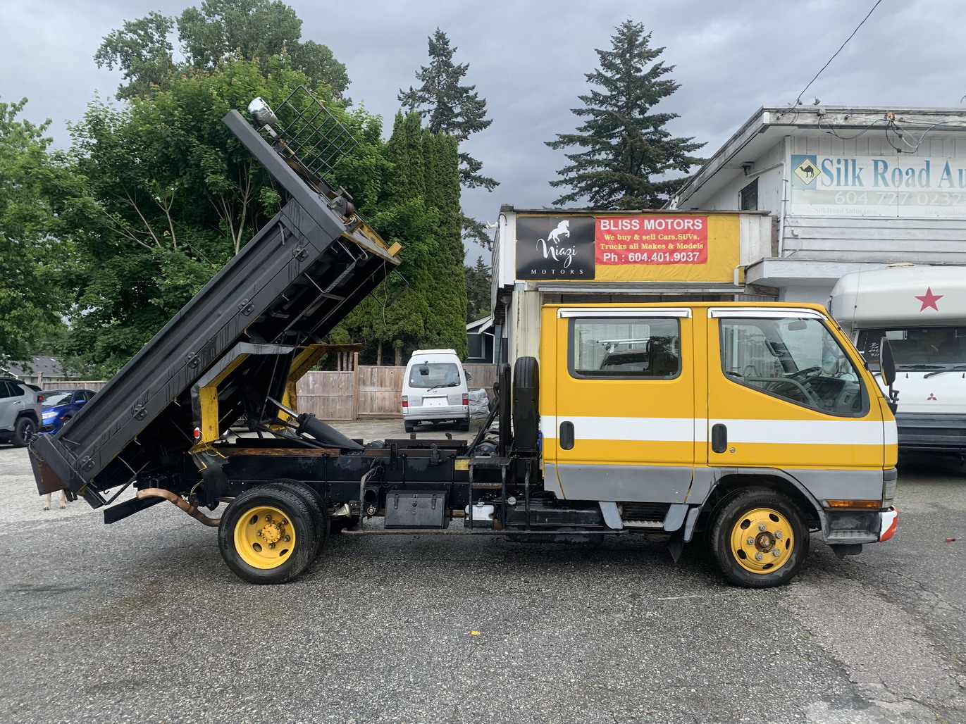 Toyota Hiace with pop top Mitsubishi canter